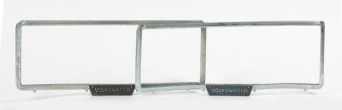 VOLKSWAGEN: A pair of circa 1970s metal Volkswagen number plate surrounds, 13.5 x 17cm overall