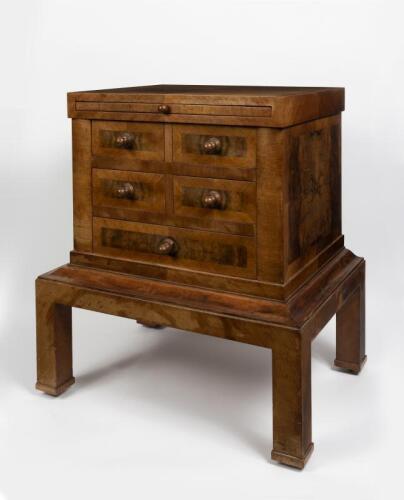 CHEST ON STAND: An Art Deco style walnut and kingwood five drawer chest on stand, with pull out work surface, 65cm high