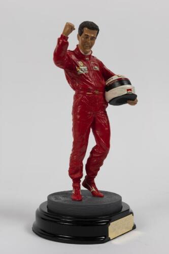 MICHAEL SCHUMACHER: A 1:9 scale limited edition (2429/5000) cold cast porcelain resin figure of Michael Schumacher sculpted by Paul Szeiler for Endurance Ltd, on wooden base with engraved plaque, NIB and accompanied by a COA from The Art of Sport, 22cm hi