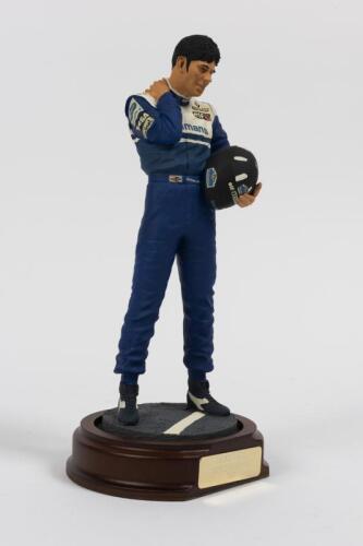 DAMON HILL: A 1:9 scale limited edition (537/2500) cold cast porcelain resin figure of Damon Hill sculpted by Paul Szeiler for Endurance Ltd, on wooden base with engraved plaque, NIB and accompanied by a COA from The Art of Sport, 24cm high