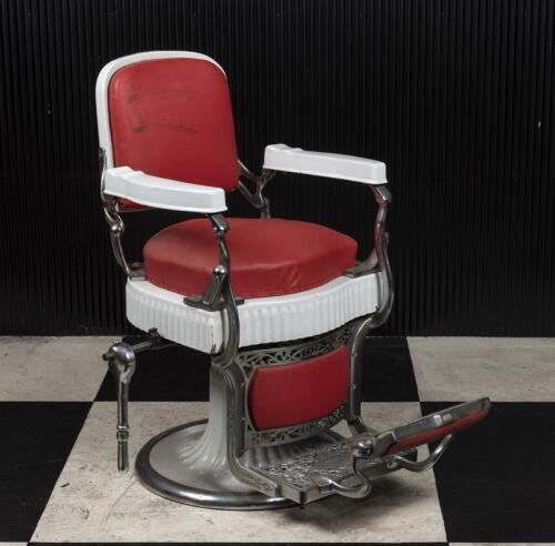 BARBERS CHAIR: An original 1920s American barbers chair by Koken, St. Louis, enamelled and chromed steel