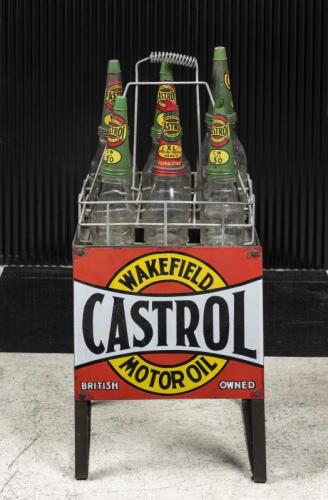 CASTROL: An early Castrol Wakefield oil bottle rack with six embossed bottles including three quart and three pint glass bottles
