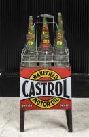 CASTROL: An early Castrol Wakefield oil bottle rack with six embossed bottles including three quart and three pint glass bottles