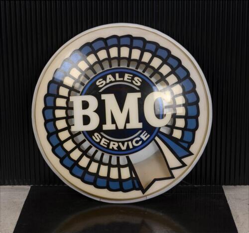 BMC: A 1950/60s illuminated "BMC Sales Service" sign, faded, 88cm diameter, 14cm deep