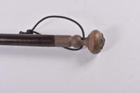 SWAGGER STICK: A trench art swagger stick with brass and copper handle featuring an applied collar dog form the Royal Regiment of Australian Artillery and a bullet to the other end, 66cm long - 4