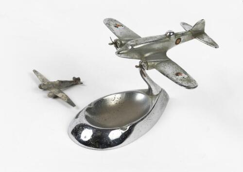 SPITFIRE: An Art Deco cast aluminium model of a spitfire mounted on ashtray, together with another small model of a plane, 10cm high