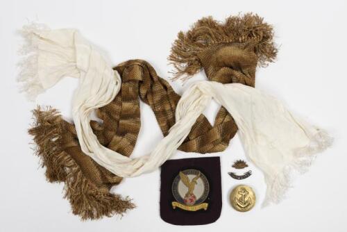 MILITARIA: A collection of military items, including badges, a buckle and a white silk flying scarf