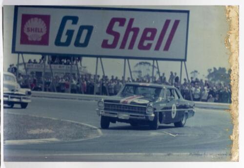 NORM BEECHEY: A mounted picture of Norm Beechey in his two door, 5.3 litre Chevrolet Nova 11 at Calder Park in 1967, 50.5 x 76cm