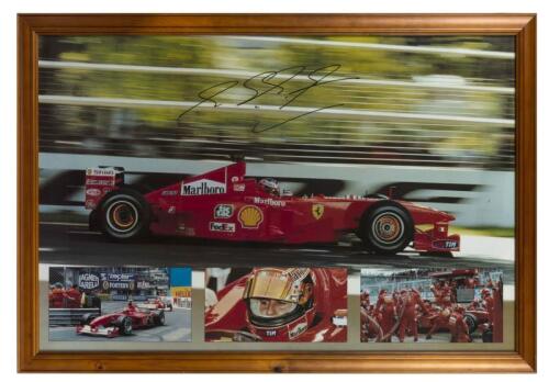 MICHAEL SCHUMACHER: A framed poster of Michael Schumacher with reproduction signature, 68 x 98cm overall
