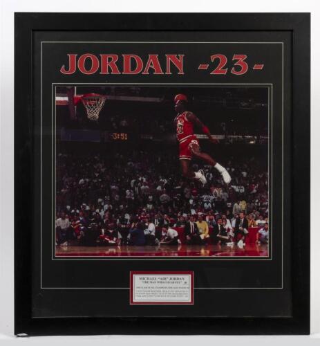 MICHAEL JORDAN: A framed poster of Michael Jordan 23, "The Man Who Could Fly", 74 x 86cm overall
