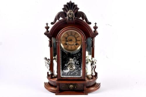 EIGHT DAY CLOCK: An early 20th century walnut eight day Triumph mantel clock by the Ansonia Clock Company