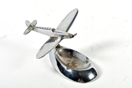 DESK PIECE: An Art Deco chromed figure of an aeroplane on ashtray base, 8cm high