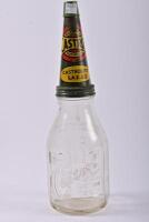 CASTROL: An early Castrol Wakefield oil bottle rack with six embossed bottles including three quart and three pint glass bottles - 24