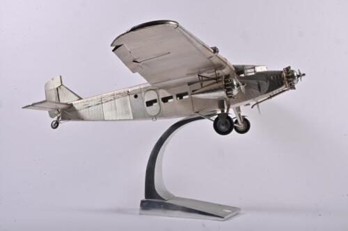 FORD: An impressive large reproduction metal skinned Art Deco style model of a Ford Trimotor three-engined transport aircraft by Authentic Models, 103cm wide wing span