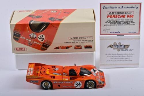 PORSCHE: A limited edition 1:18 scale Biante Porsche 956 as raced by Brock/Perkins in the 1984 LE Mans 24 Hour, #34, with COA signed by Brock numbered 371/2500, roof signed by Perkins, in fitted box, fade box (SALEROOM NOTICE)