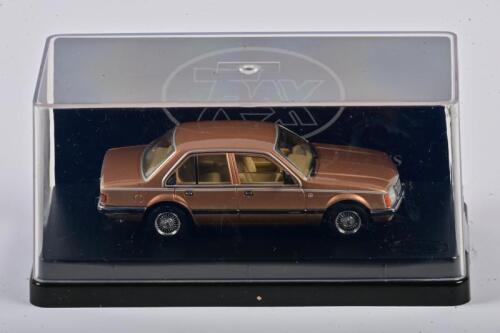 COMMODORE: A 1:43 scale Trax Holden VC Commodore L Sedan 1981, Gold, TR61C, in perspex case
