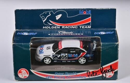 PETER BROCK: A 1:43 scale Classic Carlectables Holden Commodore as race by Brock in HRT Racing Commodore, #05, hand signed by Brock, in fitted box