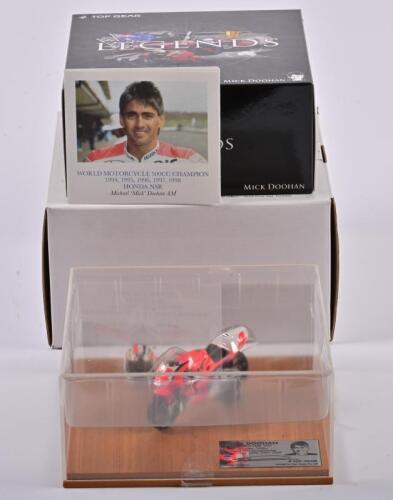 MICK DOOHAN: A 1:24 scale limited edition "Legends" Honda NSR 500 model accompanied by Doohan`s helmet by Top Gear, winner of 500cc GP Championship 1994,1995,1996,1997,1998, metal plaque hand signed by Mick Doohan, numbered 480/1000, comes with a pamphlet