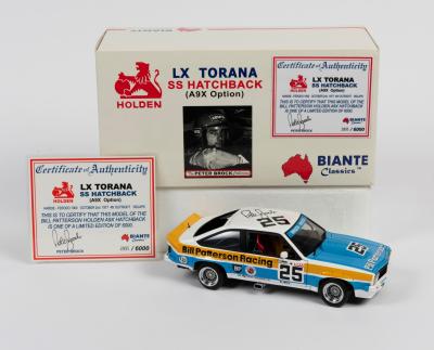 PETER BROCK: A 1:18 scale Biante LX Torana SS Hatchback (A9X option) as race by P.Brock, #25, with signed COA numbered 2895/6000, roof hand signed by Brock, spoiler is scratch and missing the rear window, in fitted box with a stock laminated copy of COA