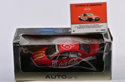 COCA COLA: A limited edition 1:18 scale Autoart Commodore VT as race by Gardner/Brabham in the 1999 Wayne Gardner Racing 'Coca Cola', with COA numbered 3885/6000, in fitted window poor condition box