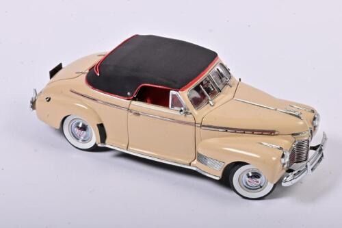 CHEVROLET: A 1:24 scale Danbury Mint Chevrolet 1941 Special Deluxe, convertible, cream with red interior, roof/tonneau cover convertible present but loose, no box