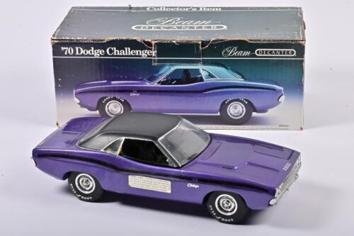 JIM BEAM: A Jim Beam 1970 Dodge Challenger Decanter 750ml, purple, slight peeling off the paint on one side of the car, in fitted box