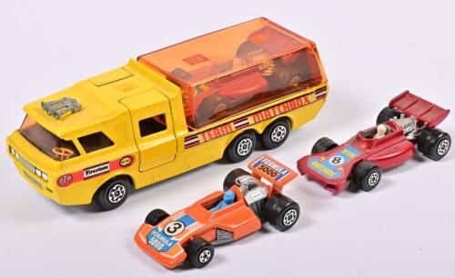 RACING CAR TRANSPORTER: A 1:43 scale Matchbox Super King K-7 racing car transporter with three formula 1 cars, made in England, no box