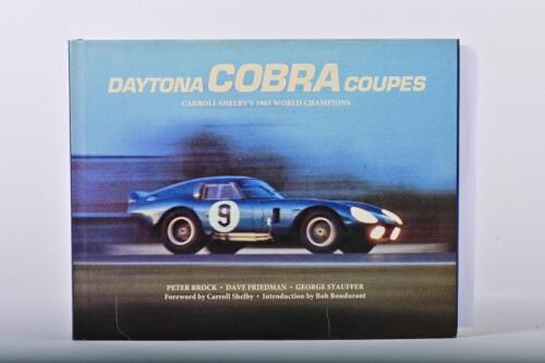 COBRA: A superb copy of 'DAYTONA COBRA COUPES' by Peter Brock, Dave Friedman, George Stauffer. Title page with various signatures including Frank Gardner, Jack Sears, Peter Sutcliffe