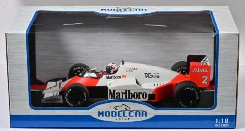 McLAREN:A 1:18 scale MODEL CAR GROUP McLaren-TAG MP4/2B (MCG18606F) as raced to victory by Alain Prost at the 1985 Monaco Grand Prix. Model never displayed