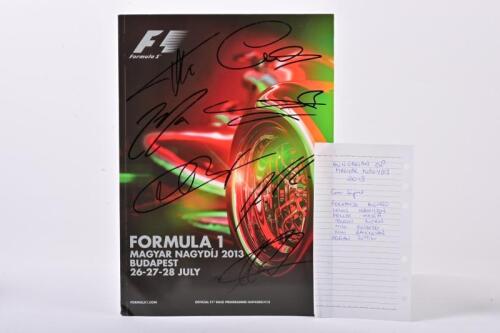 FORMULA 1: A 2013 Race Hungarian formula one GP race programme with cover being autographed by drivers including Felipe Massa, Adrian Sutil, Lewis Hamilton and 4 others.