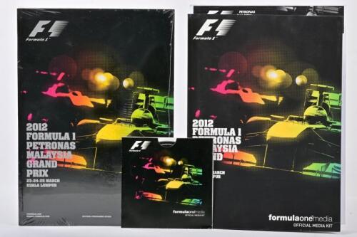 FORMULA 1: Three Items Relating to the 2012 Formula 1 Malaysian GP including a sealed copy of the race programme, the official media kit guide, and also the media kit CD disc.