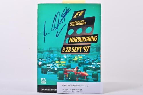 FORMULA 1: A Original 1997 German Formula 1 GP autographed race programme from the Nurburgring, autographed by Michael Schumacher and Jacques Villeneuve.
