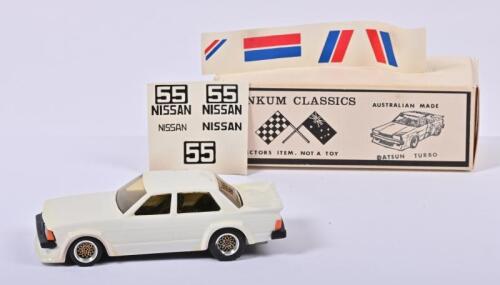 DINKUM CLASSICS: A 1:43 scale DINKUM CLASSICS "DATSUN TURBO". White with unapplied decal set. Superb