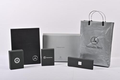 MERCEDES-BENZ: A collection of five modern Mercedes-Benz related items. Mercedes-Benz data card set, Edition Motorsport writing set, Mercedes-Benz key fob USB stick