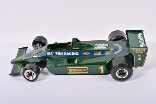 LOTUS: A 1:14 scale Bburago Lotus 80 in Martini Racing livery (2105)