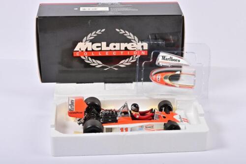 McLAREN: A 1:18 scale Minichamps 1976 James Hunt World Champion McLAREN FORD M23 with Marlboro decals