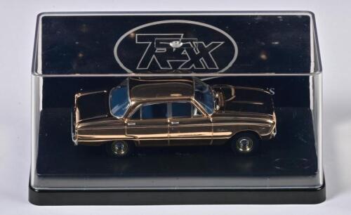 FORD: A 1:43 scale TRAX FORD XK Falcon Sedan (TRG26). Gold plated to celebrate the 50th Anniversary since release of the Ford Falcon