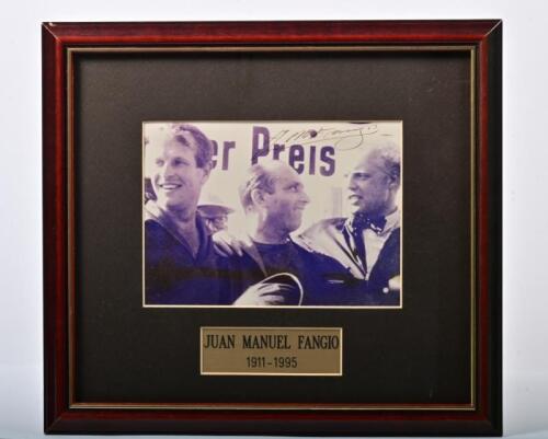 FANGIO: A signed group picture of Juan Manuel Fangio, Mike Hawthorn and Peter Collins from 1957 German Grand Prix. Picture signed by Juan Manuel Fangio