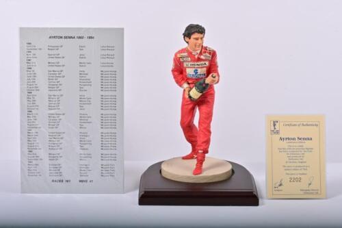 AYRTON SENNA: A 1:9 scale limited edition (2202/7500) cold cast porcelain resin figure of Ayrton Senna (3rd Edition). With metal plaque detailing racing career of Ayrton Senna