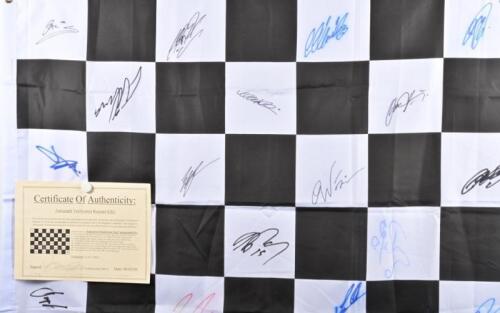 CHEQUERED FINISH LINE FLAG: An exceptional Formula One chequered finish line flag with COA, autographed by Michael Schumacher, Mark Webber, David Coulthard and 27 F1 personalities (30 signatures in total) 1520x900mm