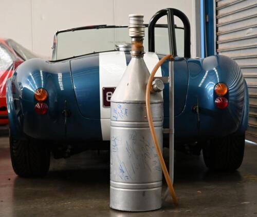 1979 BATHURST FUEL CHURN: A superb and original 1979 Bathurst aluminium fuel churn. Churn signed by multiple A.T.C.C and Supercar identities