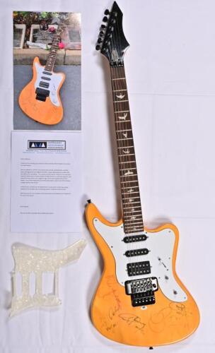 AC/DC: A rare circa 1970s electric guitar signed by AC/DC band members Bon Scott, Malcolm Young, Angus Young, Phil Rudd and Cliff Williams, with CoA