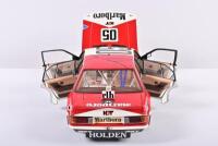 COMMODORE: A limited edition 1:18 scale Classic Carlectables Holden VH Commodore as race by Brock/Perkins in 1982 Bathurst, #05, with a colored copy of COA numbered 378/4500, disattached roof aerial, roof of the car signed by Perkins, in styrofoam box - 4