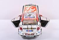 COMMODORE: A limited edition 1:18 scale Classic Carlectables Holden VE Commodore as race by Garth Tanders/ Will Davisons in 2009, with COA numbered 4361/5300, roof signed by both drivers, replica trophy included inside, in double fitted box - 5