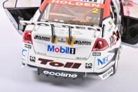 COMMODORE: A limited edition 1:18 scale Classic Carlectables Holden VE Commodore as race by Garth Tanders/ Will Davisons in 2009, with COA numbered 4361/5300, roof signed by both drivers, replica trophy included inside, in double fitted box - 6