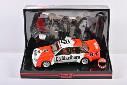 COMMODORE: A 1:18 scale Biante Holden VK Commodore, Holden Dealer Team as race by Brock/ Perkins in 1984 Hardie- Ferodo 1000 Winner, #05, with a helmet model, with a copy of COA numbered 11422/15000 glued it at the box, in fitted box, fade box