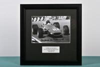 deADAMICH: A black and white image of Andrea de Adamich racing a Ferrari 312 at the South African Grand Prix Kyalami 1968. Andrea de Adamich signature