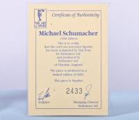 MICHAEL SCHUMACHER: A 1:9 scale limited edition (2433/5000) cold cast porcelain resin figure of Michael Schumacher sculpted by Paul Szeiler for Endurance Ltd, on wooden base with engraved plaque, NIB and accompanied by a COA from The Art of Sport, 22cm hi - 2