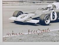 MERZARIO: A black and white picture of Arturo Merzario racing a Ferrari 312B2 at German Grand Prix, Nurburgring. Arturo Merzario signature - 3