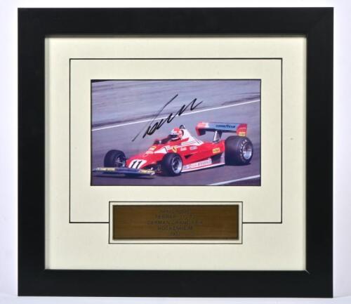 LAUDA: A colour picture of Niki Lauda racing a Ferrari 312 T2 at the German Grand Prix Hockenheim 1977. Niki Lauda signature
